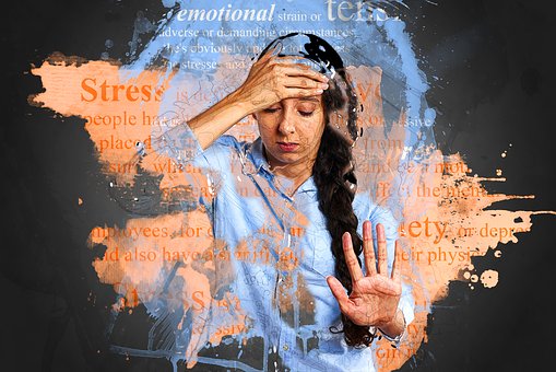 this is the featured image of the post PTSD:how it affects your dream and treatment. it shows a graphic picture of a stressed woman holding her head. with lots of thoughts and imagination running in her head.