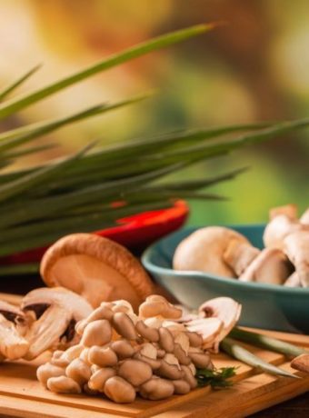 Benefits-of-mushroom-supplements-for-stress-Various-mushroom-supplements-on-a-wooden-table.