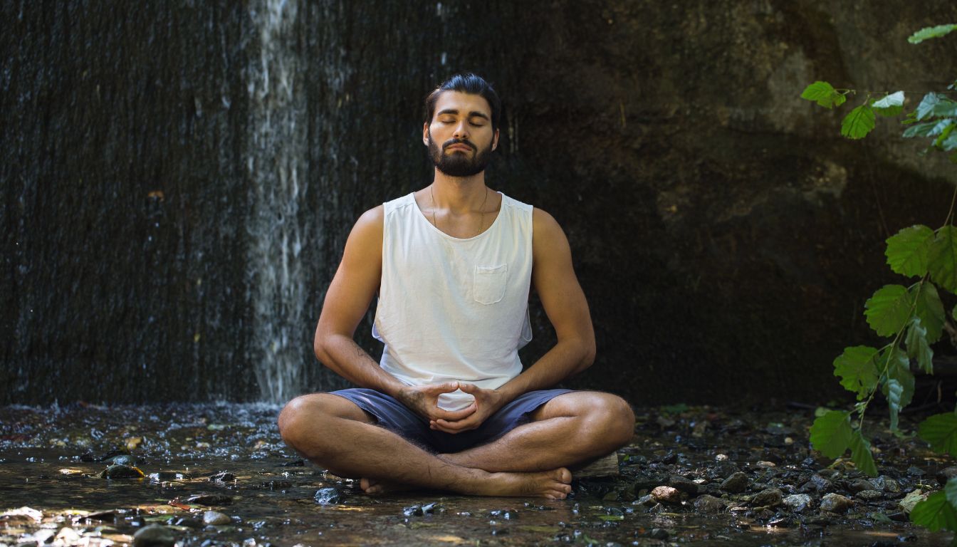 how to quickly destress- a person in nature meditating to destress how-to-quickly-destress-Person practicing deep breathing exercises for quick stress relief